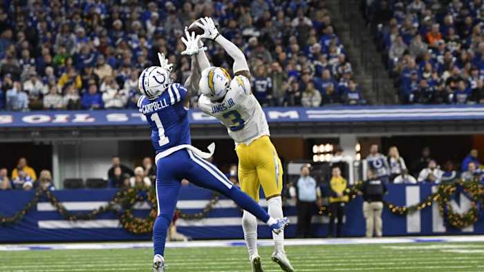 Dec 26, 2022; Indianapolis, Indiana, USA; Los Angeles Chargers safety Derwin James Jr. (3) intercepts a pass meant for Indianapolis Colts wide receiver Parris Campbell (1) during the first quarter at Lucas Oil Stadium.